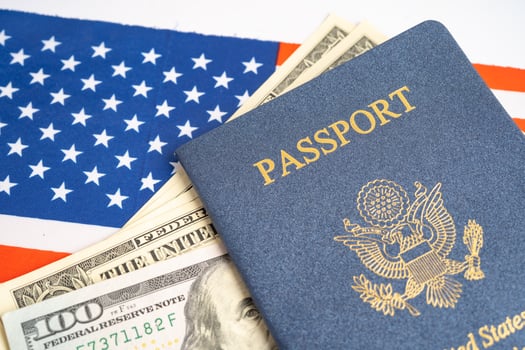 US passport issued to citizen and national of the United States of America to travel in most countries outside with USA flag and dollar money. photo