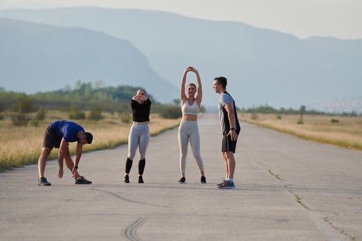Diverse Group of Athletes Prepare Together for a Run photo