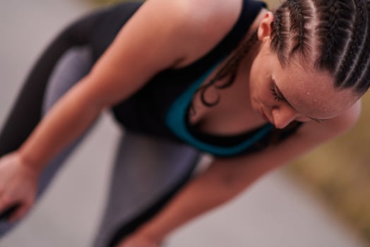 Close-Up Portrait of Determined Athlete Resting After Intense Workout photo