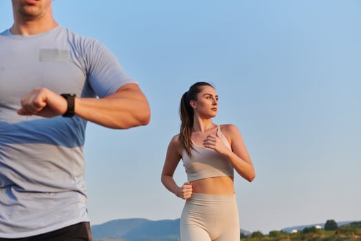 A group of friends maintains a healthy lifestyle by running outdoors on a sunny day, bonding over fitness and enjoying the energizing effects of exercise and nature photo