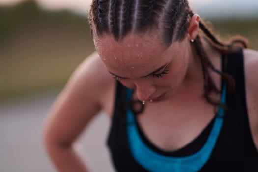 Close-Up Portrait of Determined Athlete Resting After Intense Workout photo
