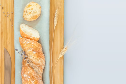 Sliced fresh crispy handmade French baguette with knife photo