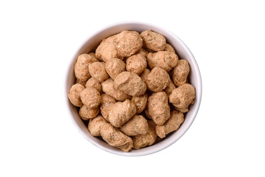 Dry soybean meat pellets, diet food for vegan and vegetarian cuisine photo