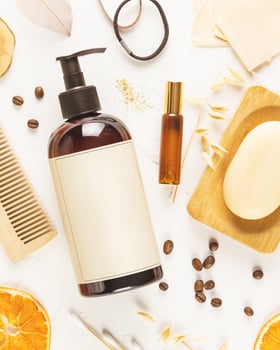 Hair care card with shampoo bottle, combs, oil and accessories photo