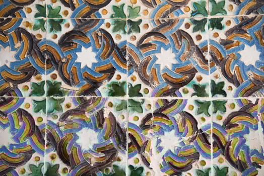Retro style tiles in a wall. Green, blue and brown color photo