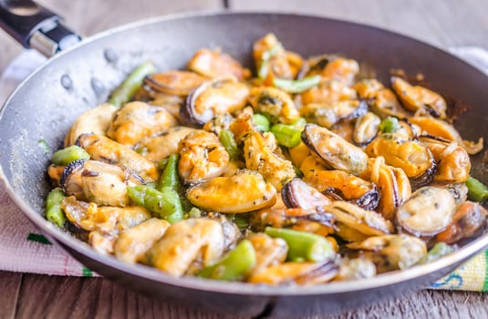 Fried mussels on the pan photo