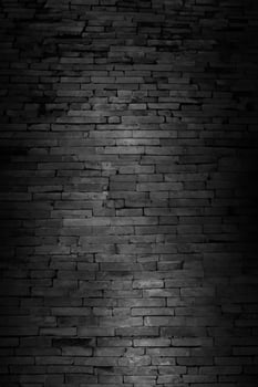 Minimalist Black Brick Wall Texture Background in Unplastered Basement photo