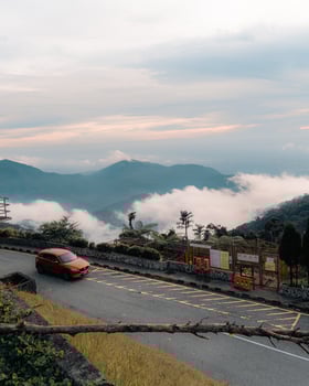 A car driving down a mountain road photo