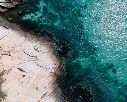 An Aerial View of the Ocean and Rocks photo