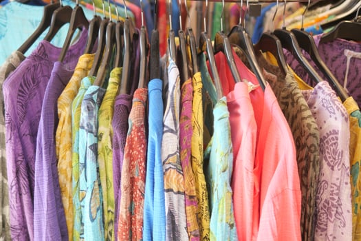 A store with a chic and neat shopping experience featuring stylish clothing on display photo