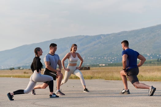Diverse Group of Athletes Prepare Together for a Run photo