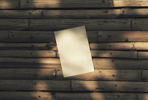 Card paper blank brown flat lay on natural dry bamboo wooden background aesthetic mockup design. photo