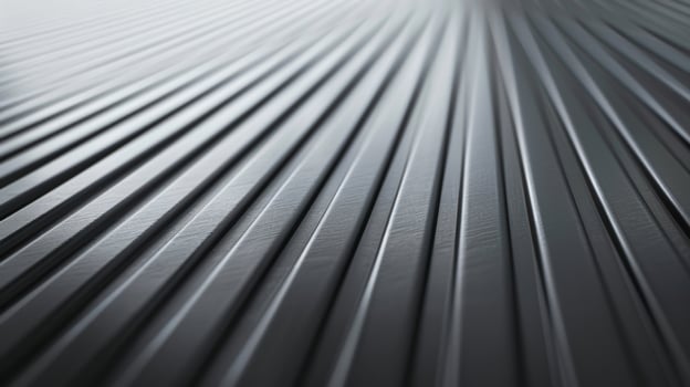Tiny horizontal lines etched into the metal creating a soft matte finish on this anodized aluminum photo