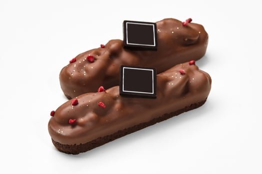 Two streusel-based bars with pecan in milk chocolate photo