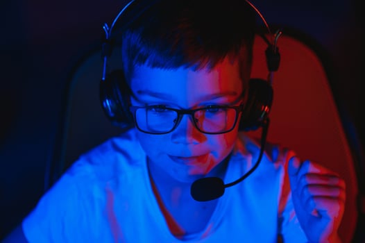 young man playing computer games on line photo