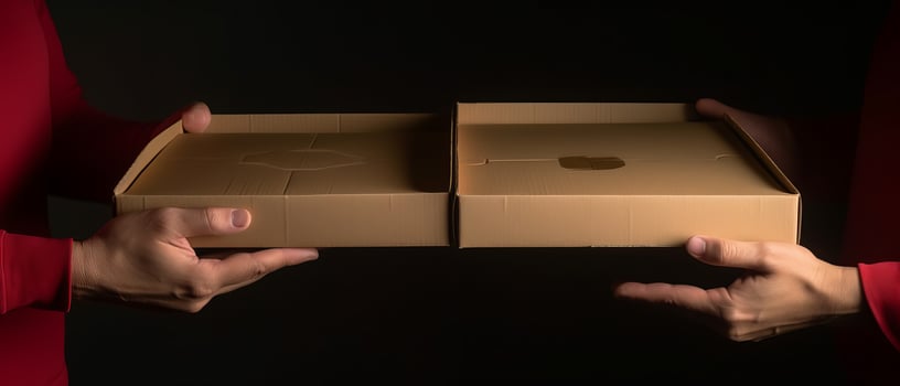 Hands holding a pizza box. Pizza is ready for delivery. . photo