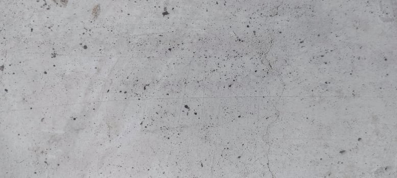 Concrete wall background, porous texture photo