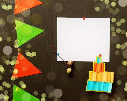 Holiday background with white sheet, garland and bokeh effect photo