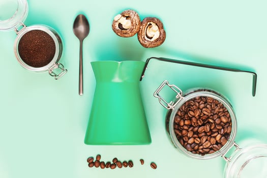 Turkish coffee pot, spoon, mushrooms and coffee beans photo