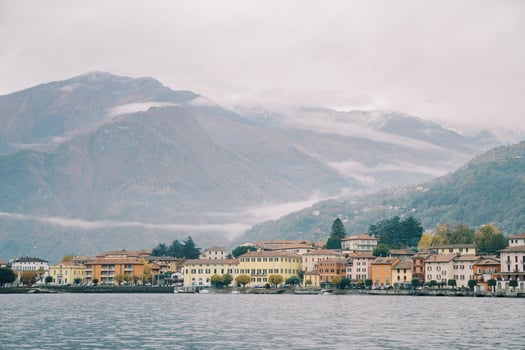 Colorful villas on the foggy mountainous coast of Lake Como. Italy photo