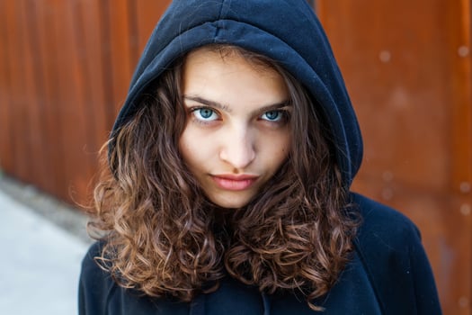 White teenager with curly hair and the most beautiful natural lips. Young girl face. photo