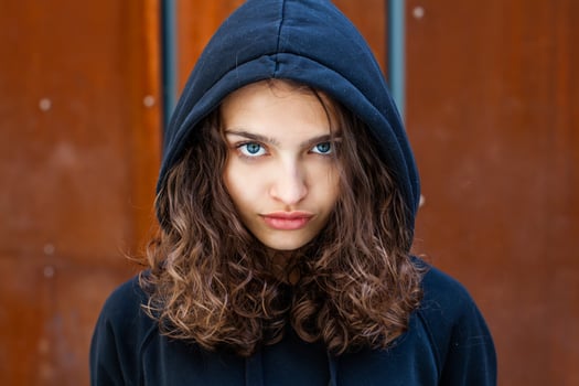 White teenager with curly hair and the most beautiful natural lips. Young girl face. photo