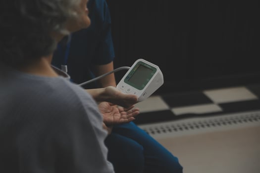 Doctor doing professional pressure examine her young patient photo