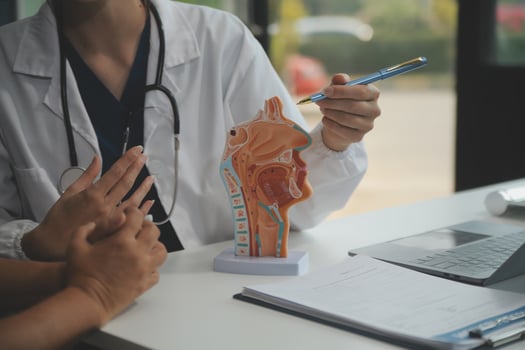 Female doctor explaining to patient results of model the process of patients. Diagnosis of diseases for Model Internal organ. photo