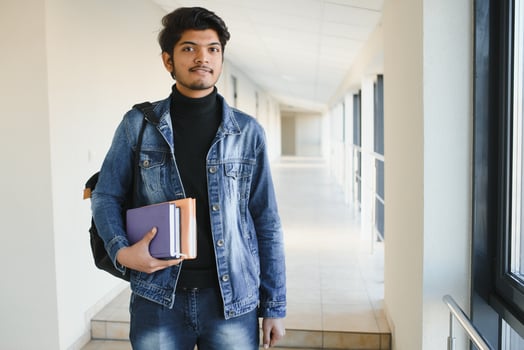 Happy indian male student at the university photo