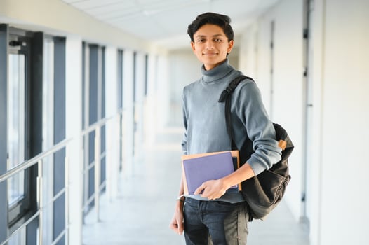 Happy indian male student at the university photo