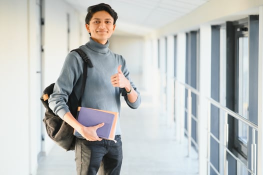 Happy indian male student at the university photo