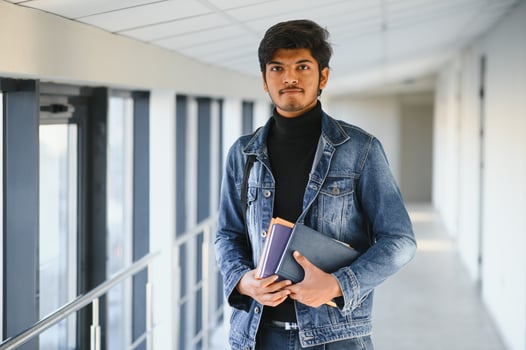 Happy indian male student at the university photo