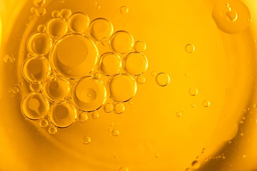 Cooking oil, cooking background, yellow oil drops and water kitchen. photo