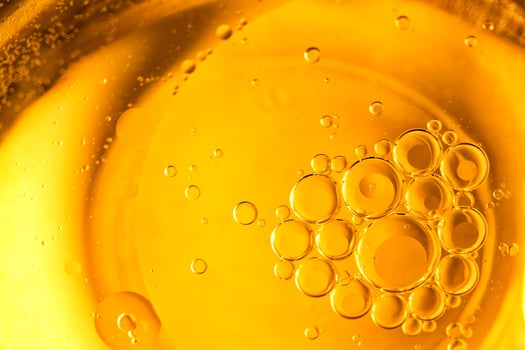 Cooking oil, cooking background, yellow oil drops and water kitchen. photo