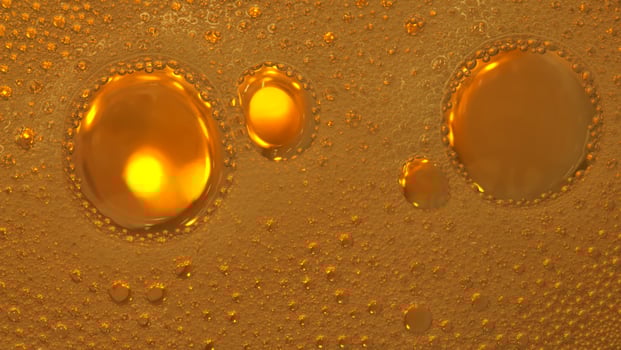 Cooking oil, water with oil emulsions and bubbles in the background. photo