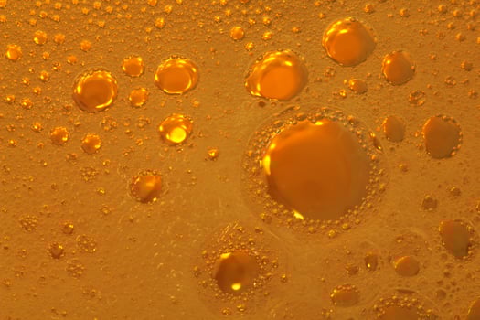 Cooking oil, water with oil emulsions and bubbles in the background. photo