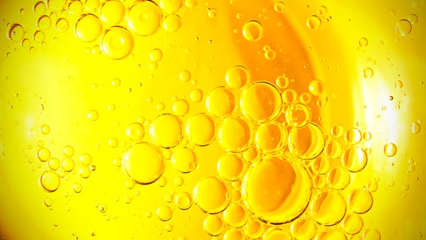 Cooking oil, cooking background, yellow oil drops and water kitchen. photo