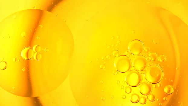 Cooking oil, cooking background, yellow oil drops and water kitchen. photo