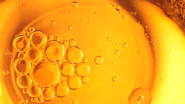 Cooking oil, cooking background, yellow oil drops and water kitchen. photo