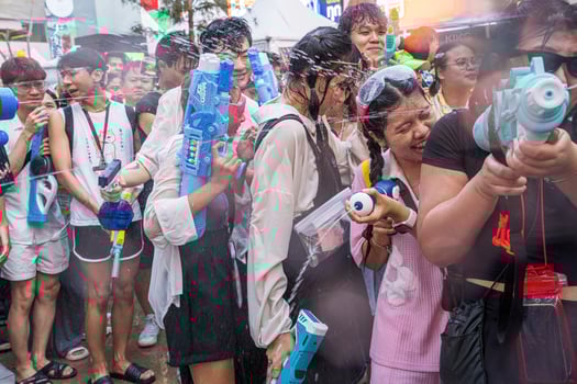 Siam Square, Bangkok, Thailand - APR 13, 2024 Songkran Festival, The short action of people joins celebrations of the Thai New Year or Songkran in Siam Square Bangkok, Thailand. photo