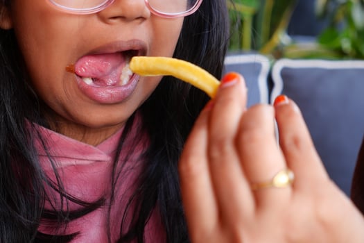 child eating french fries close up photo
