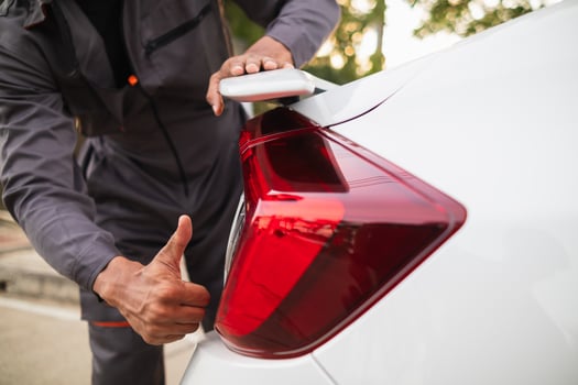 Technicians from service center inspect and assist customers cars that are having problems while traveling build confidence in customers who choose buy car from service center and receive help quickly photo