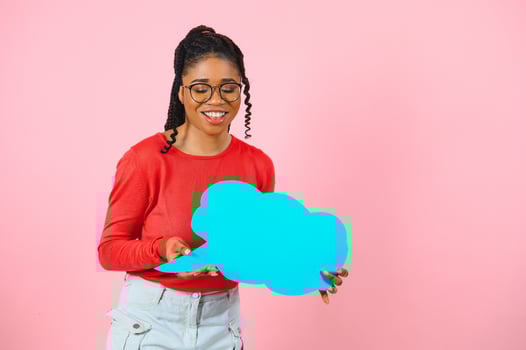 Don't Miss. Excited shocked black girl holding empty speech bubble, over pink studio wall, free space. photo