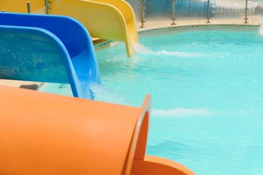 Colorful aquapark constructions in swimming-pool photo
