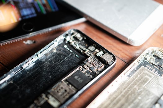Disassembled smartphones with exposed internal components photo