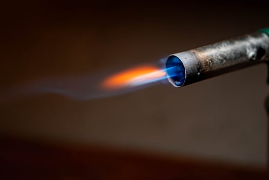 Blowtorch with blue and orange flame photo