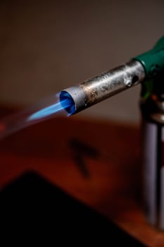 Gas blow torch with blue flame photo