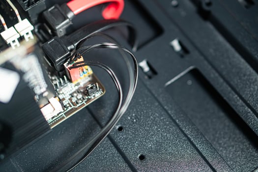 Computer motherboard with connected cables close-up photo