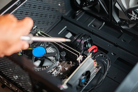 Person repairing a desktop computer photo
