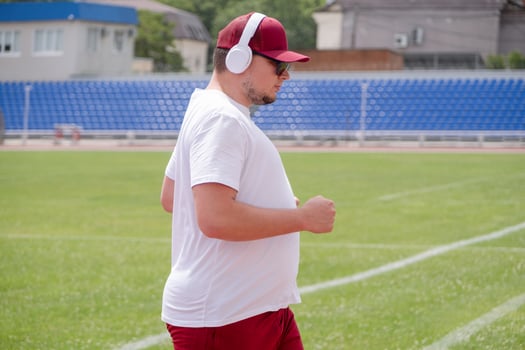 sportsman running in the stadium photo